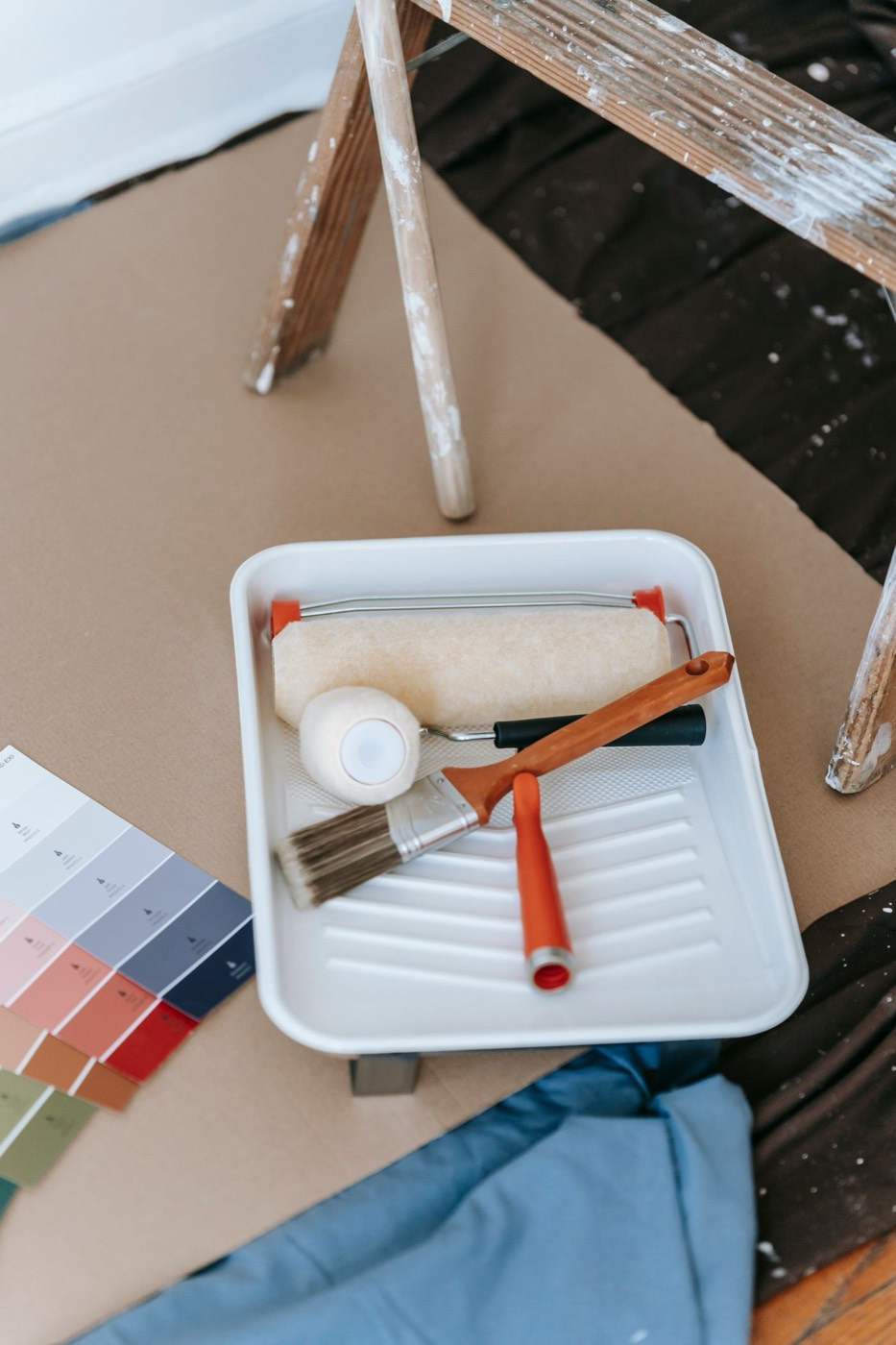 Choosing a cabinet colour from a fan deck before spraying